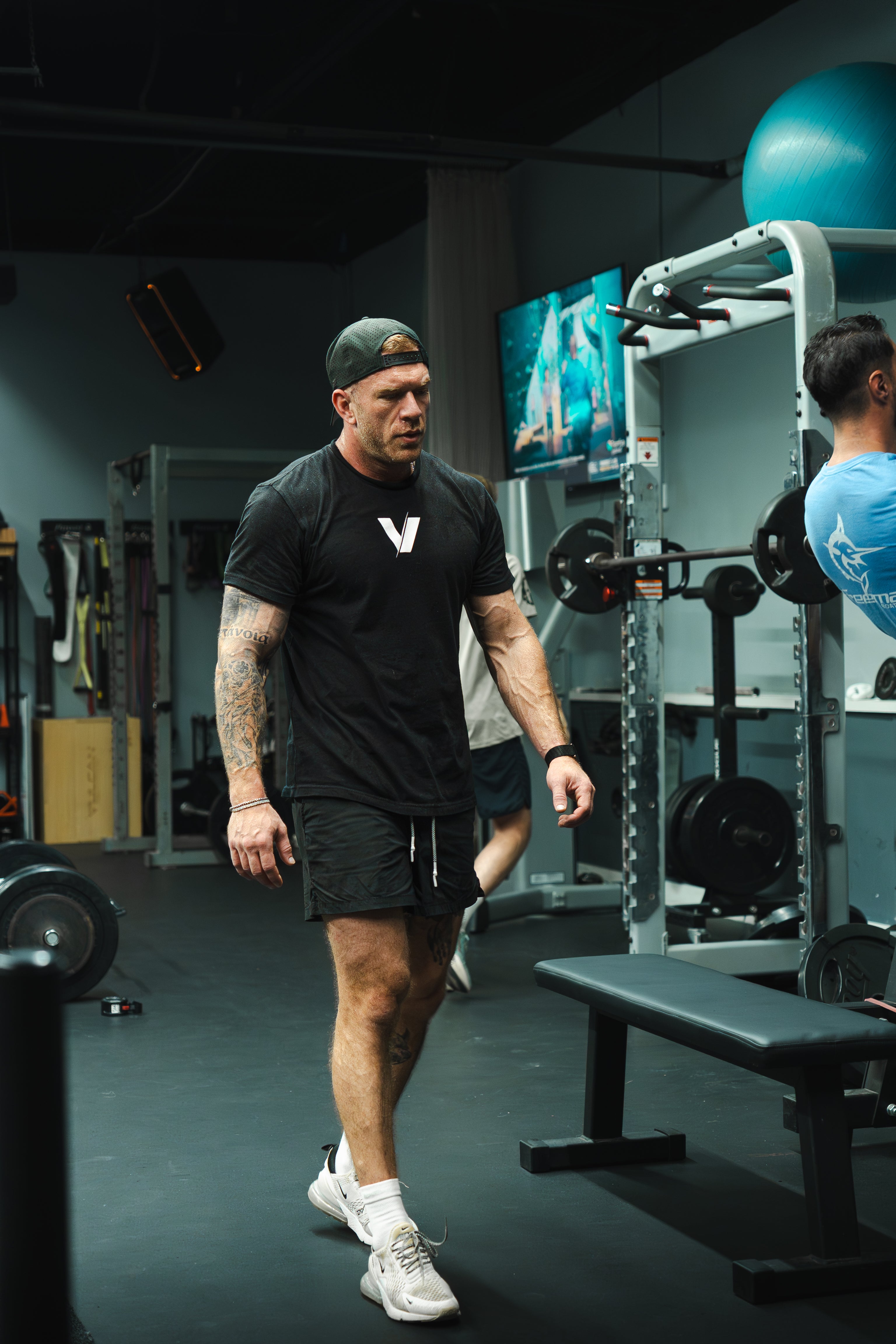 Kevin, founder of VRSTY Optimal Performance, holding VRSTY Pre Workout